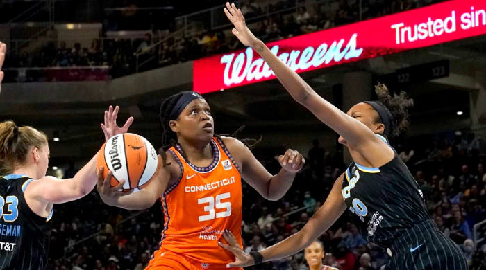 Sun's Jonquel Jones shoots as Chicago Sky's Azura Stevens defends.